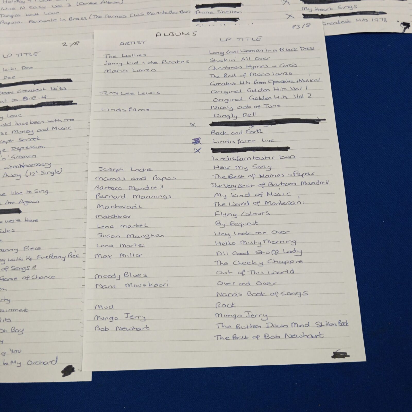 Handwritten list of album titles and artists, page four.
