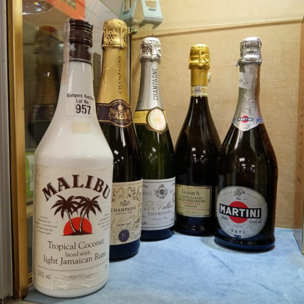 Mixed lot of vintage alcohol bottles including Martini and Malibu.