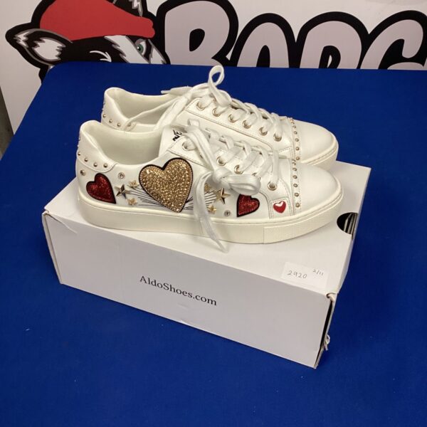 White size 4 Aldo trainers with silver studs.