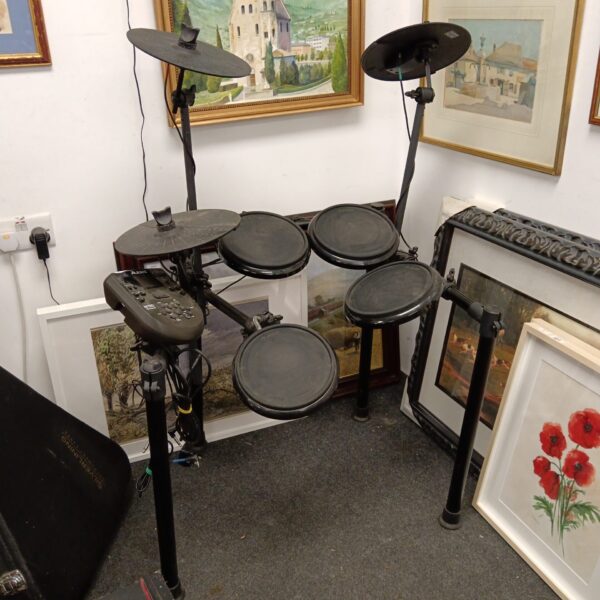 Full view of the Alesis Nitro electronic drum kit in a room setting.