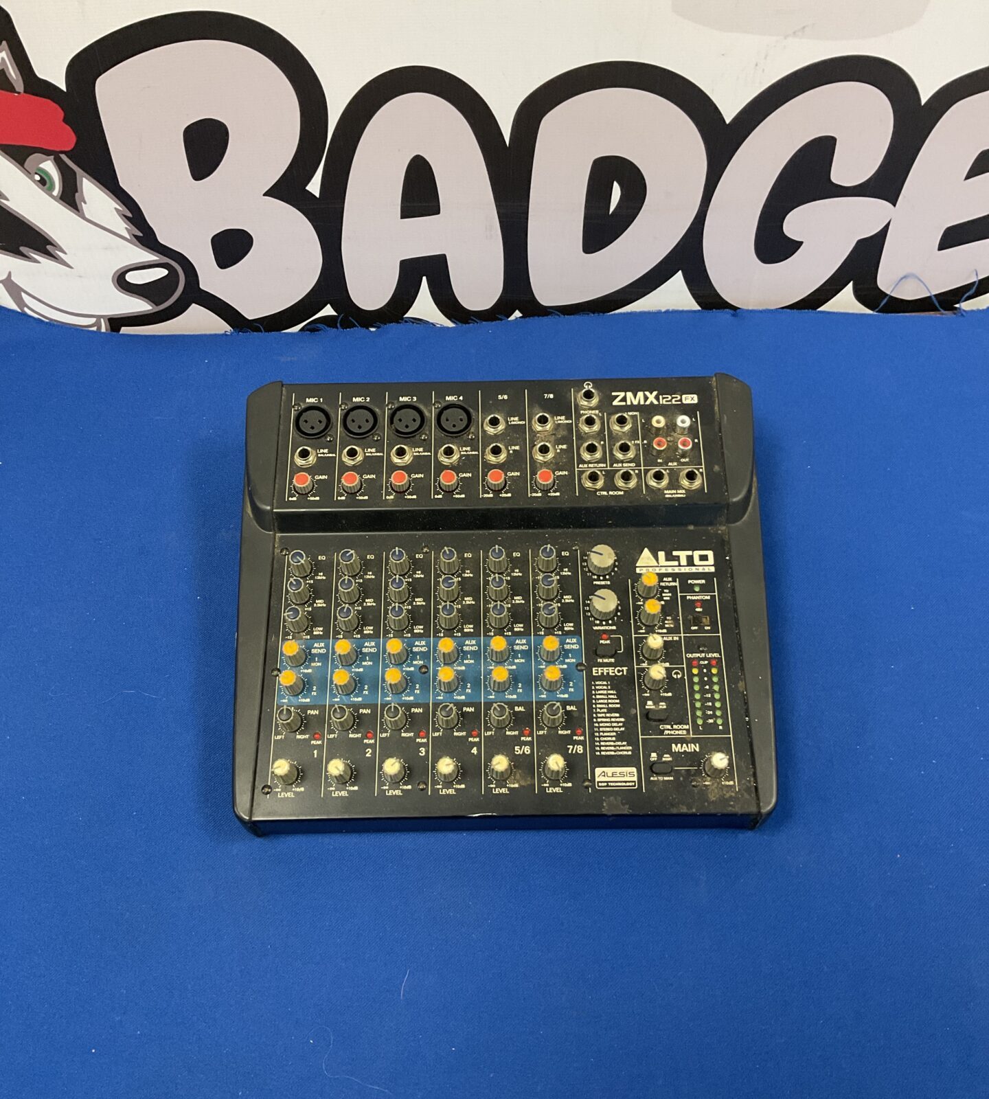 Alto Professional ZMX 122FX audio mixer with multiple channels and controls.