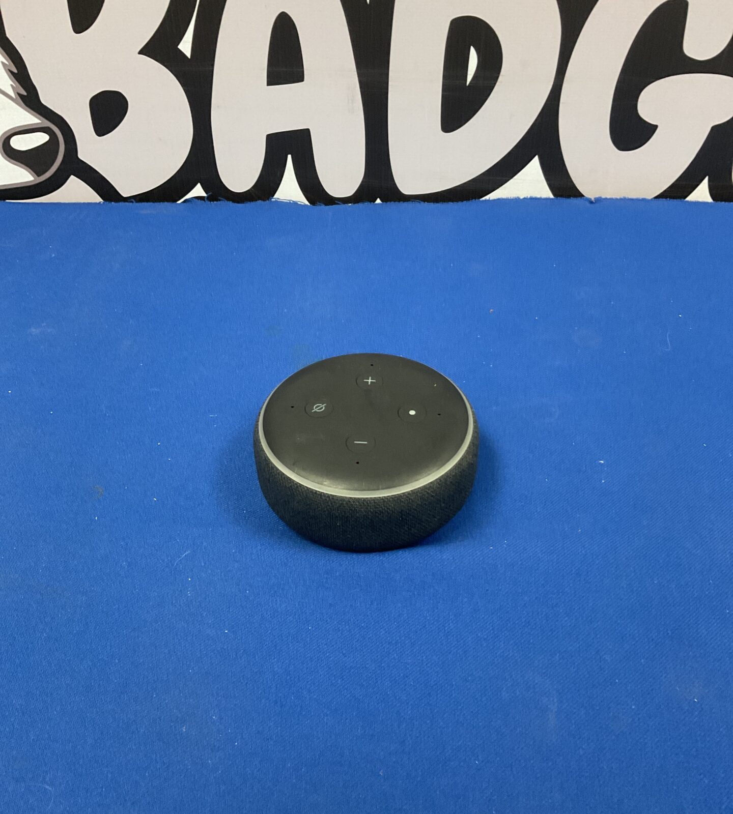 Dark fabric Amazon Alexa Echo Dot smart speaker.