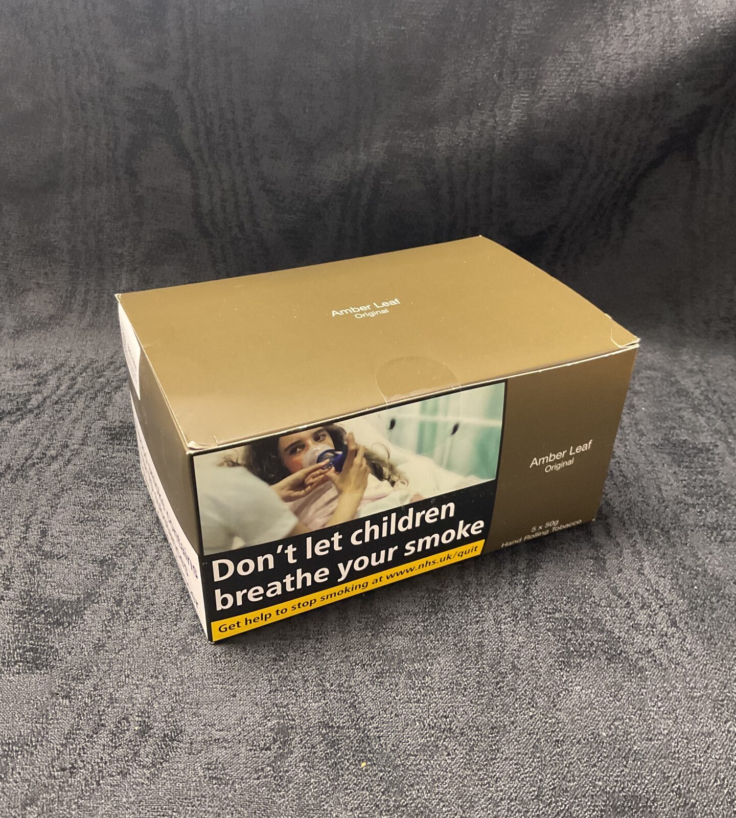 Five sealed pouches of Amber Leaf Original rolling tobacco.