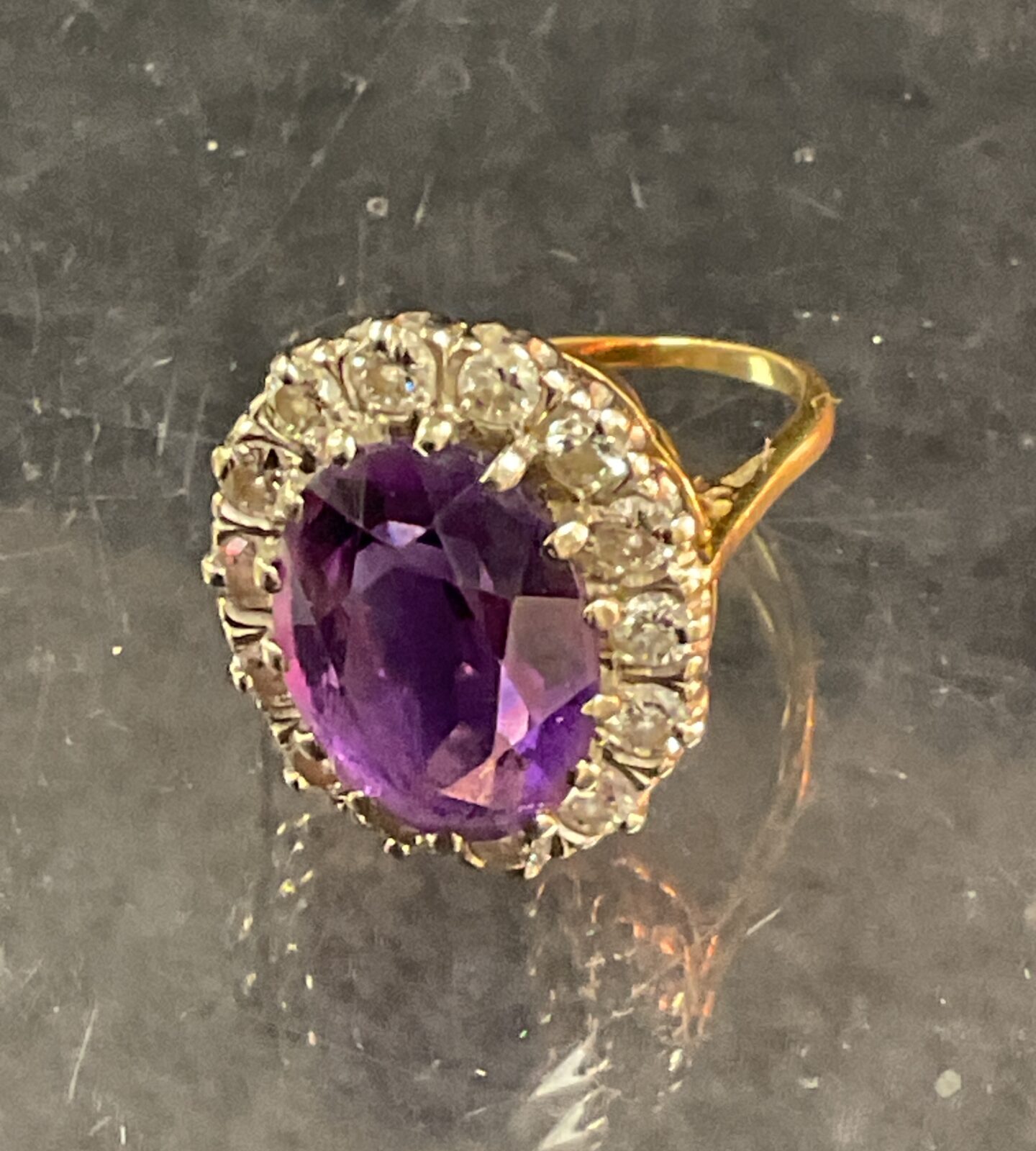 Side view of a 9 carat gold amethyst and diamond cocktail ring.