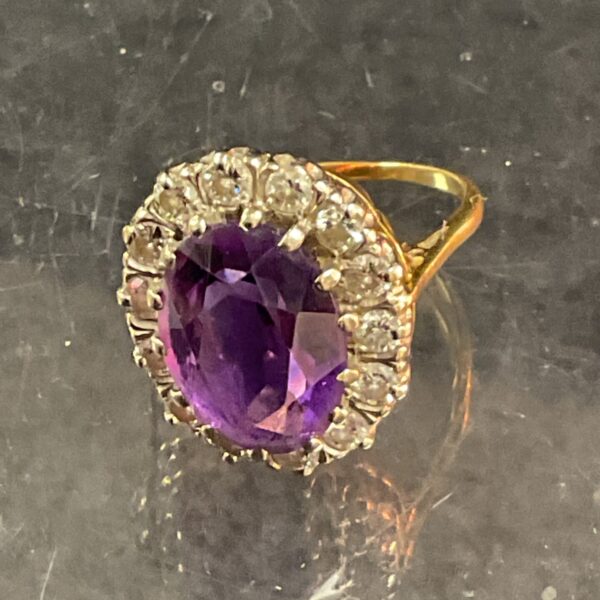 Side view of a 9 carat gold amethyst and diamond cocktail ring.
