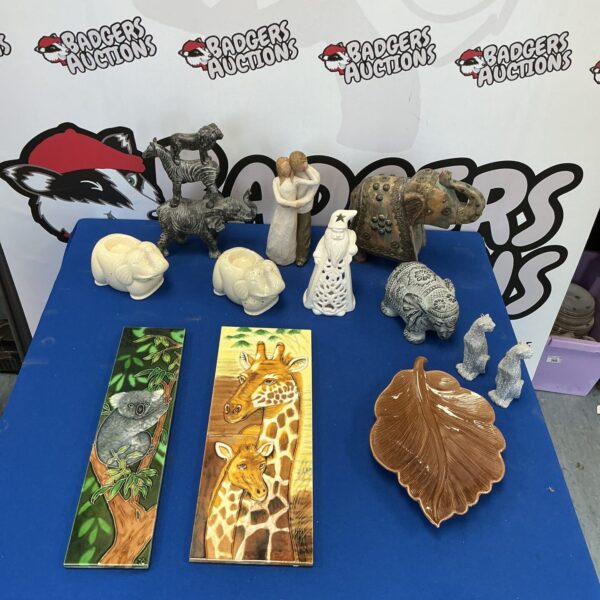 Vintage animal figurines and decorative tiles collection for home decor.