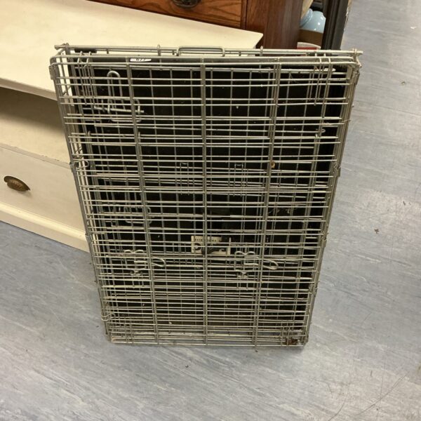 Metal wire animal transport crate for small pets.
