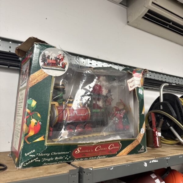 Vintage animated Christmas train ornament with sound effects and detailed cars.