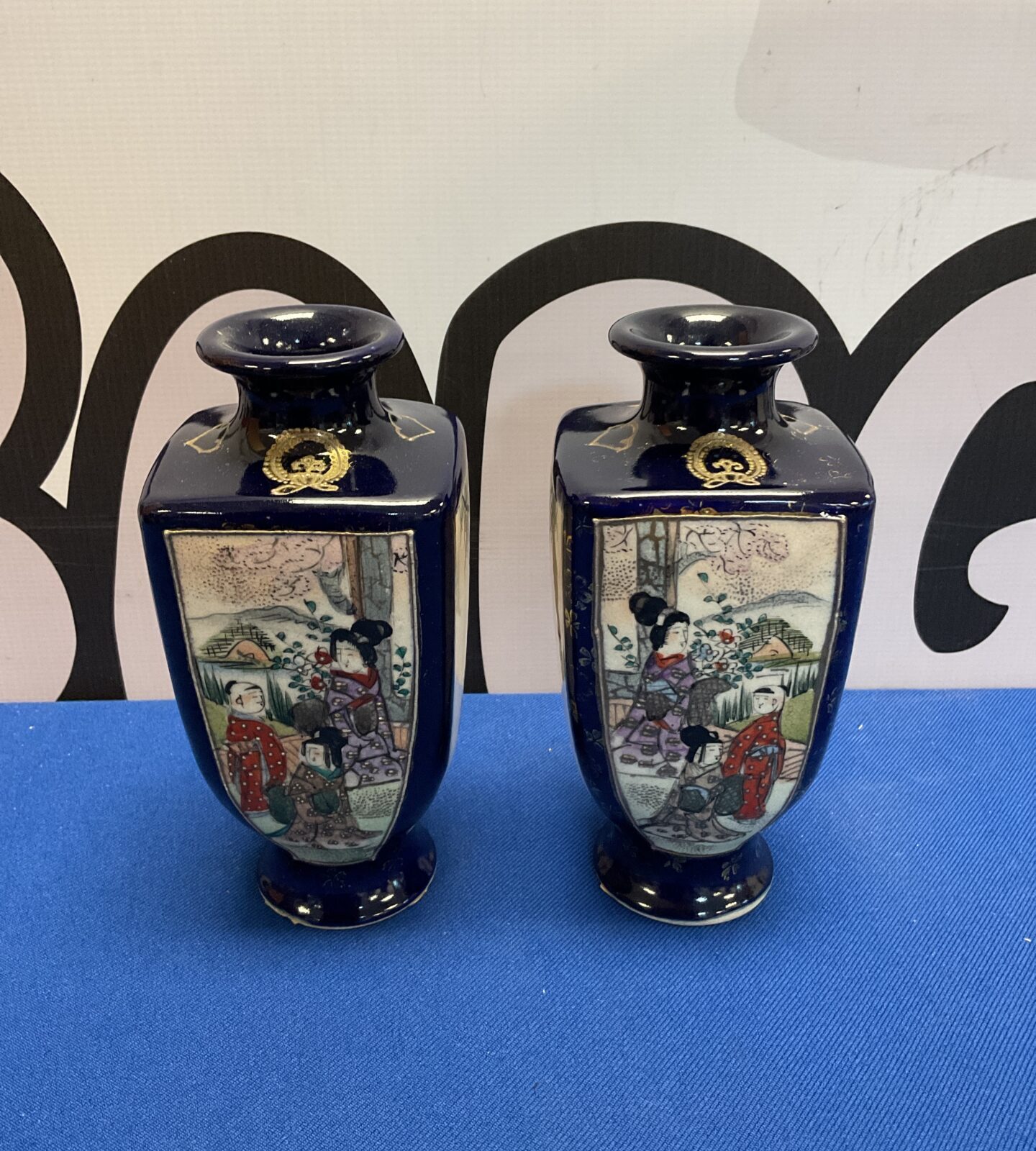 Pair of antique Chinese porcelain vases with detailed artwork.