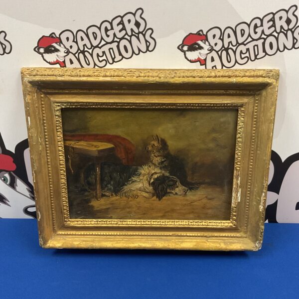 Antique oil painting of a collie and terrier in a gilt frame.