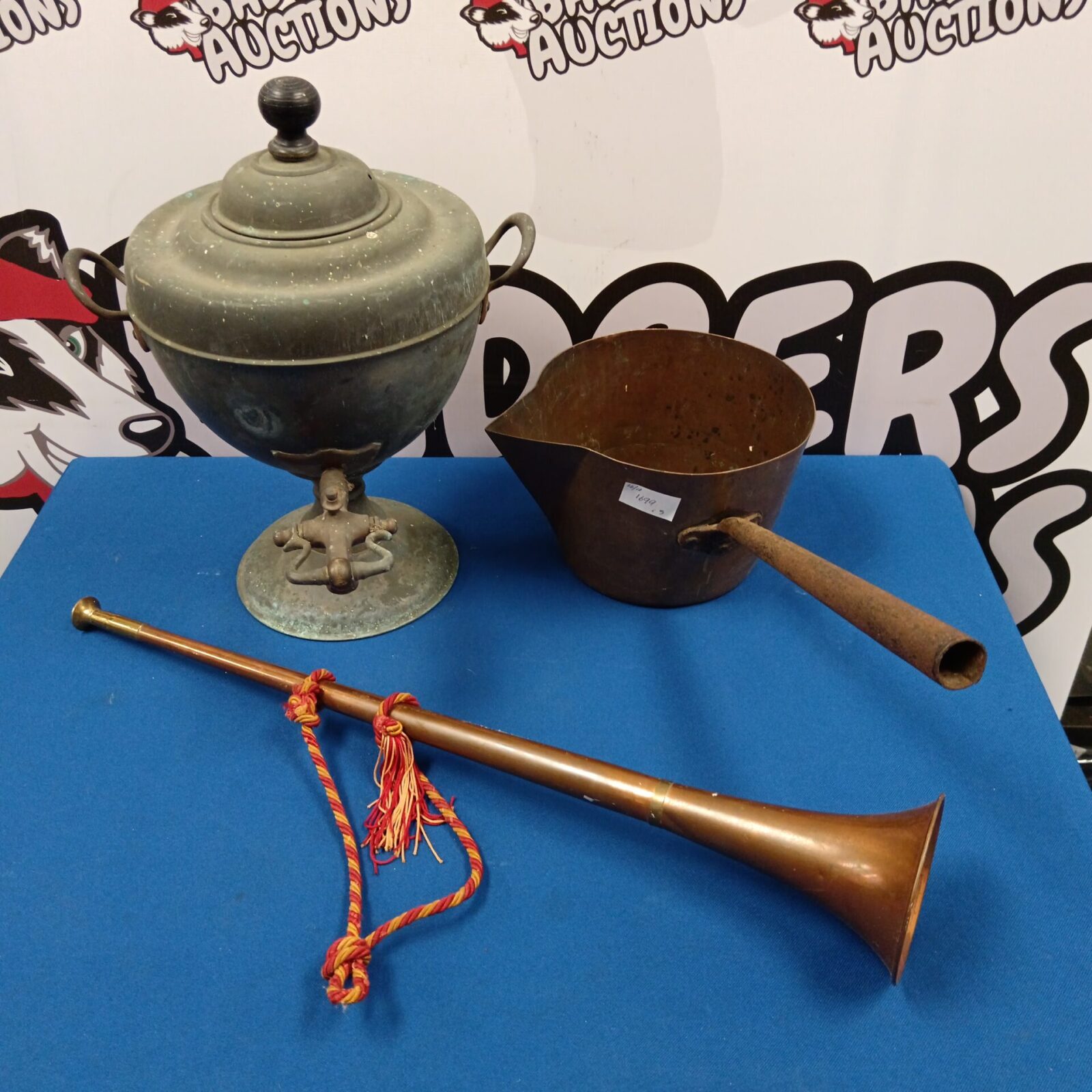 Antique copper samovar set with pan and hunting horn displayed.