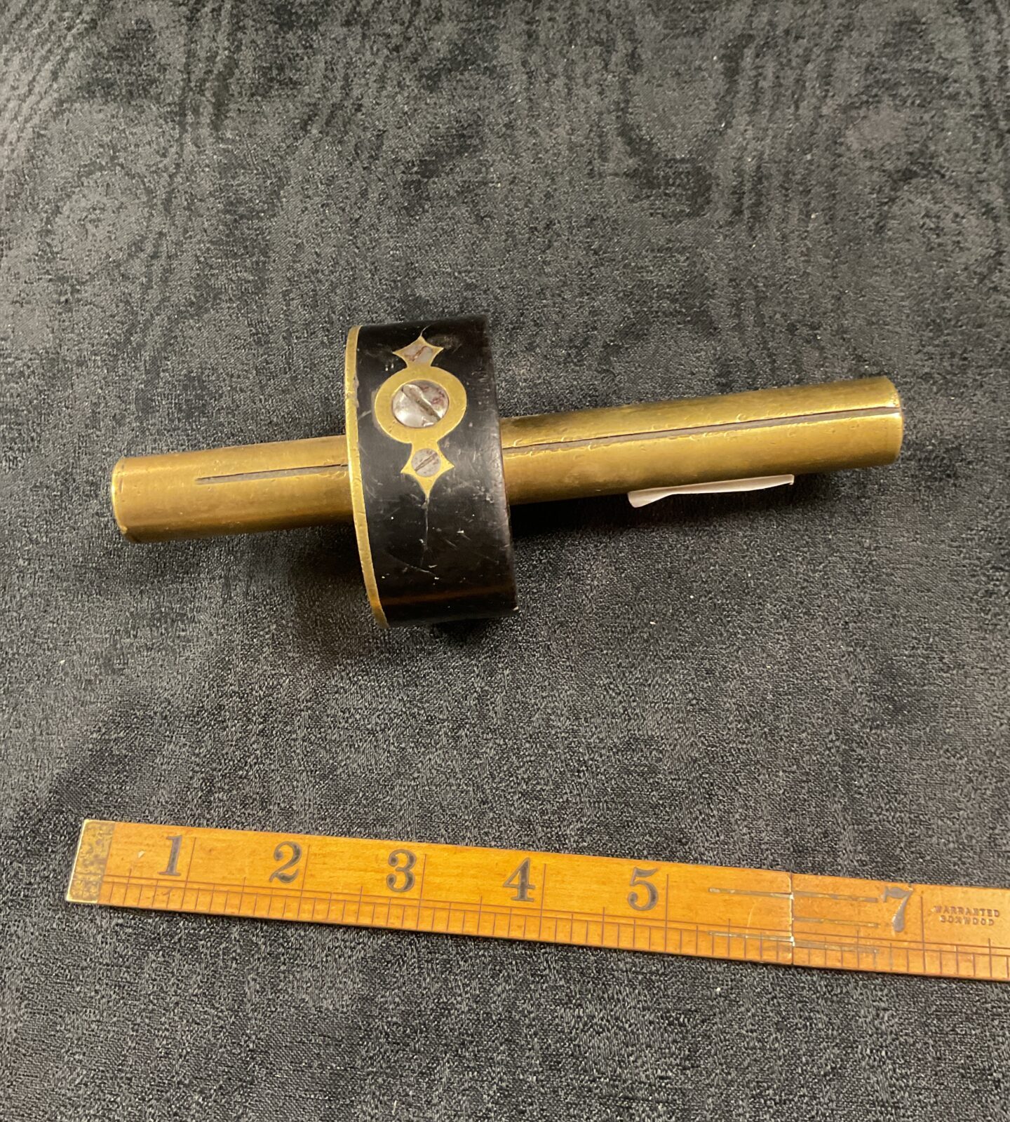Antique ebony and brass carpenters scribe for precise woodworking.