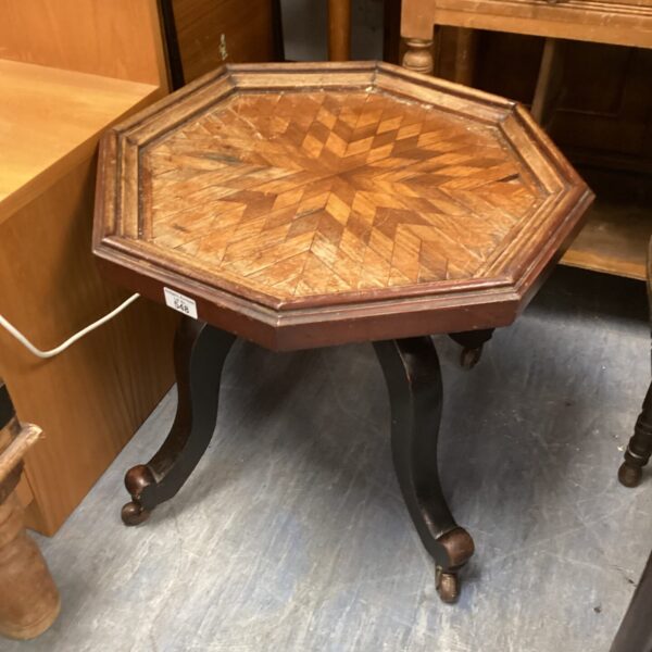 Antique hexagonal marquetry table with floral inlay and cabriole legs.