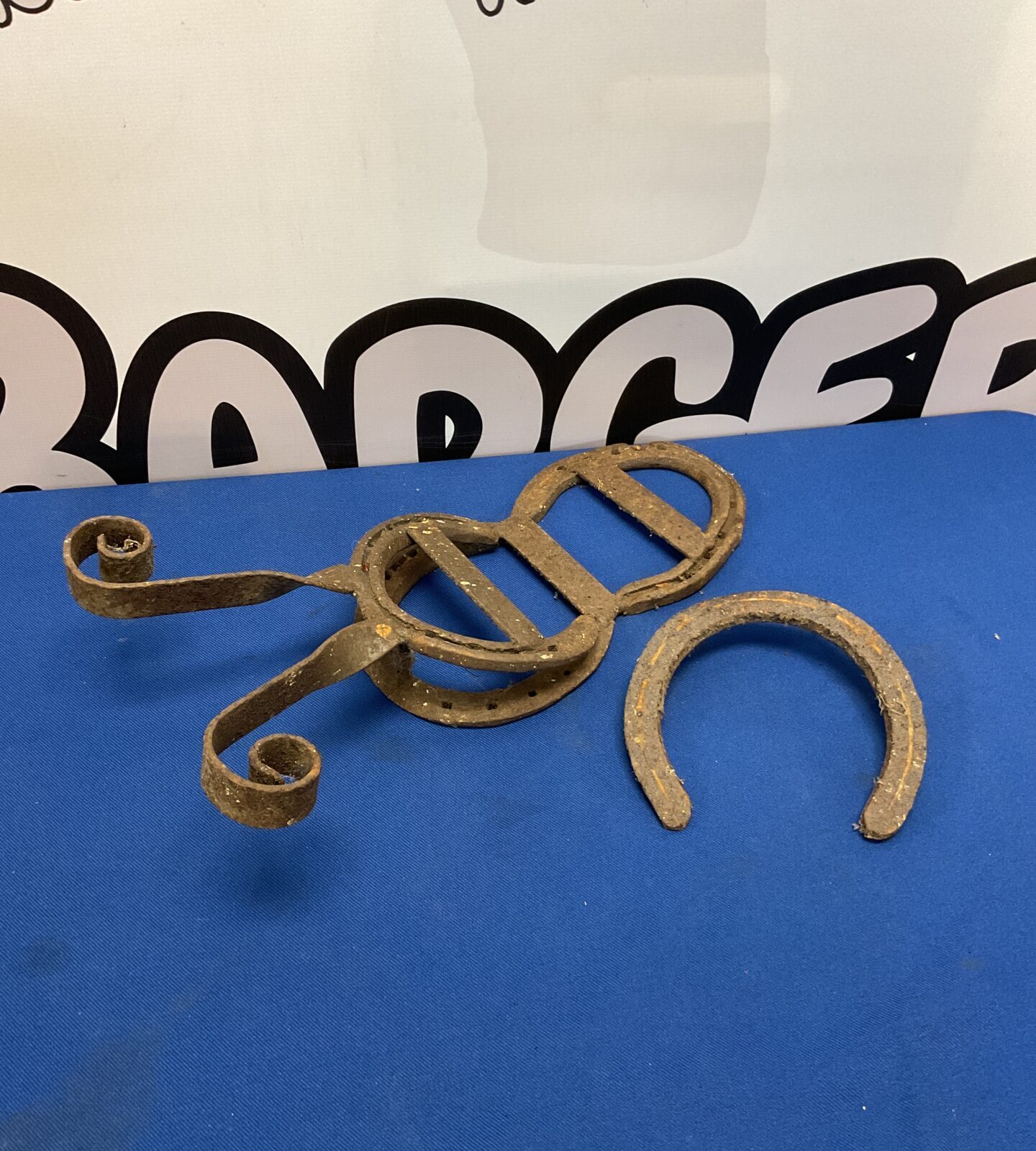 Antique horse shoe boot remover tool for equine hoof care.