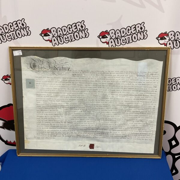 Antique indenture document on velum with a wax seal.