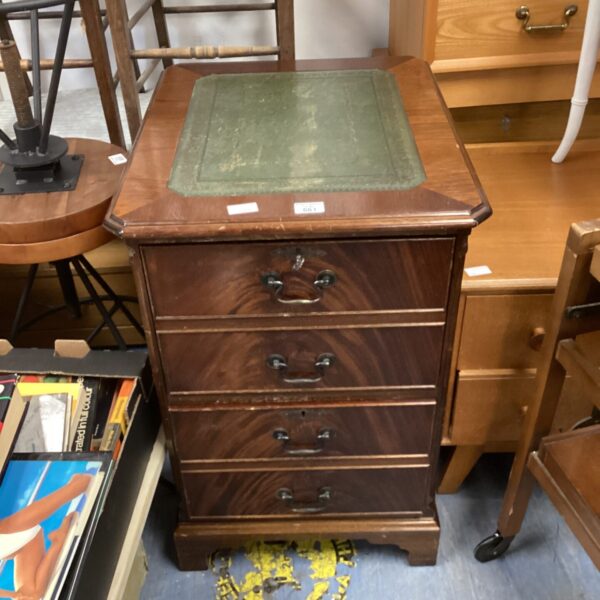 Antique mahogany filing cabinet with leather top for office storage.