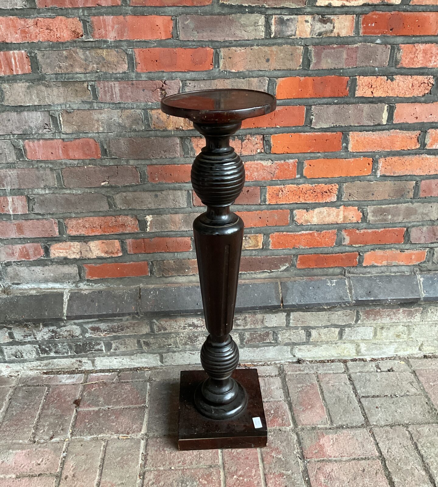 Antique mahogany jardiniere stand with fluted column and square base.