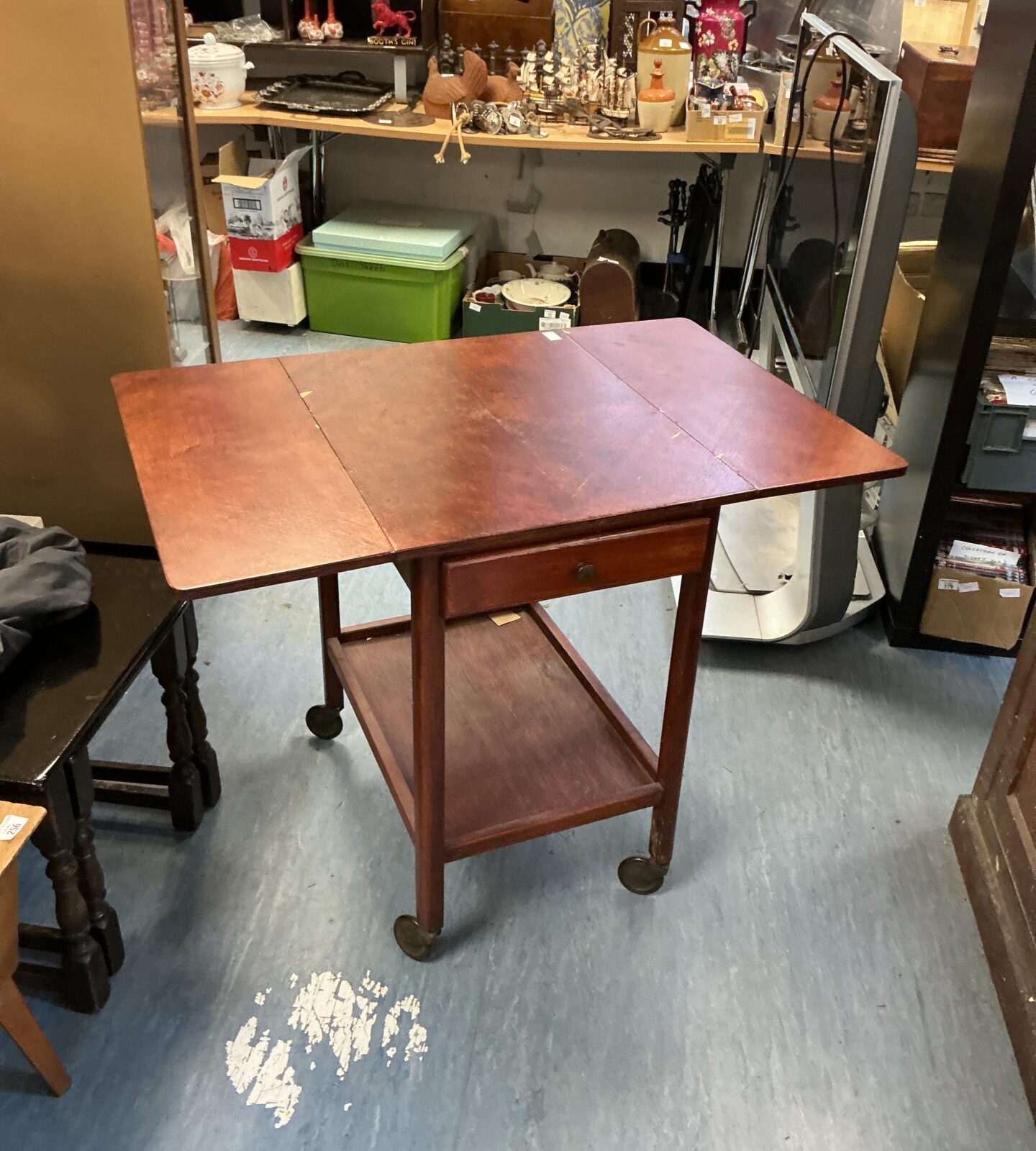 Front view of antique mahogany extending tea trolley.