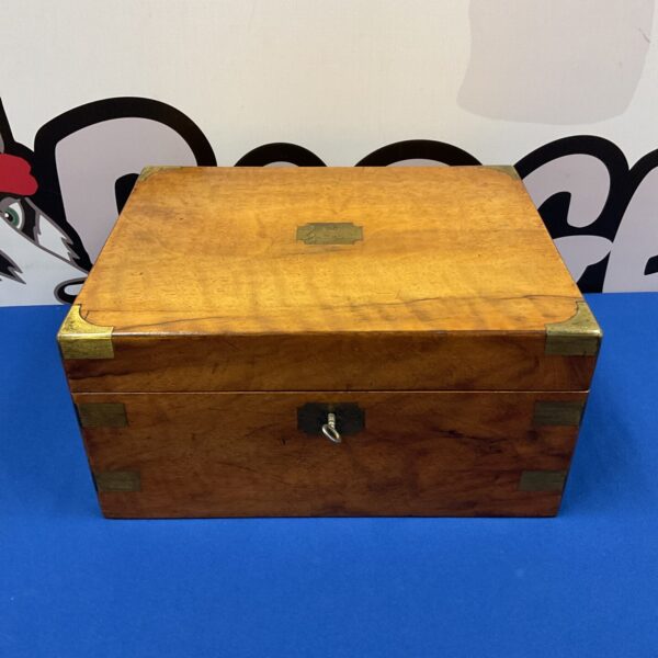 Front view of antique mahogany writing slope with key.