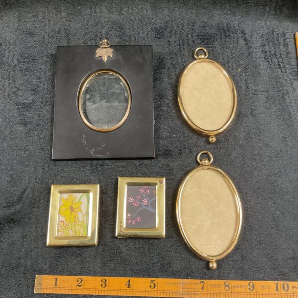 Lot of five antique miniature picture frames with gilt finishes.