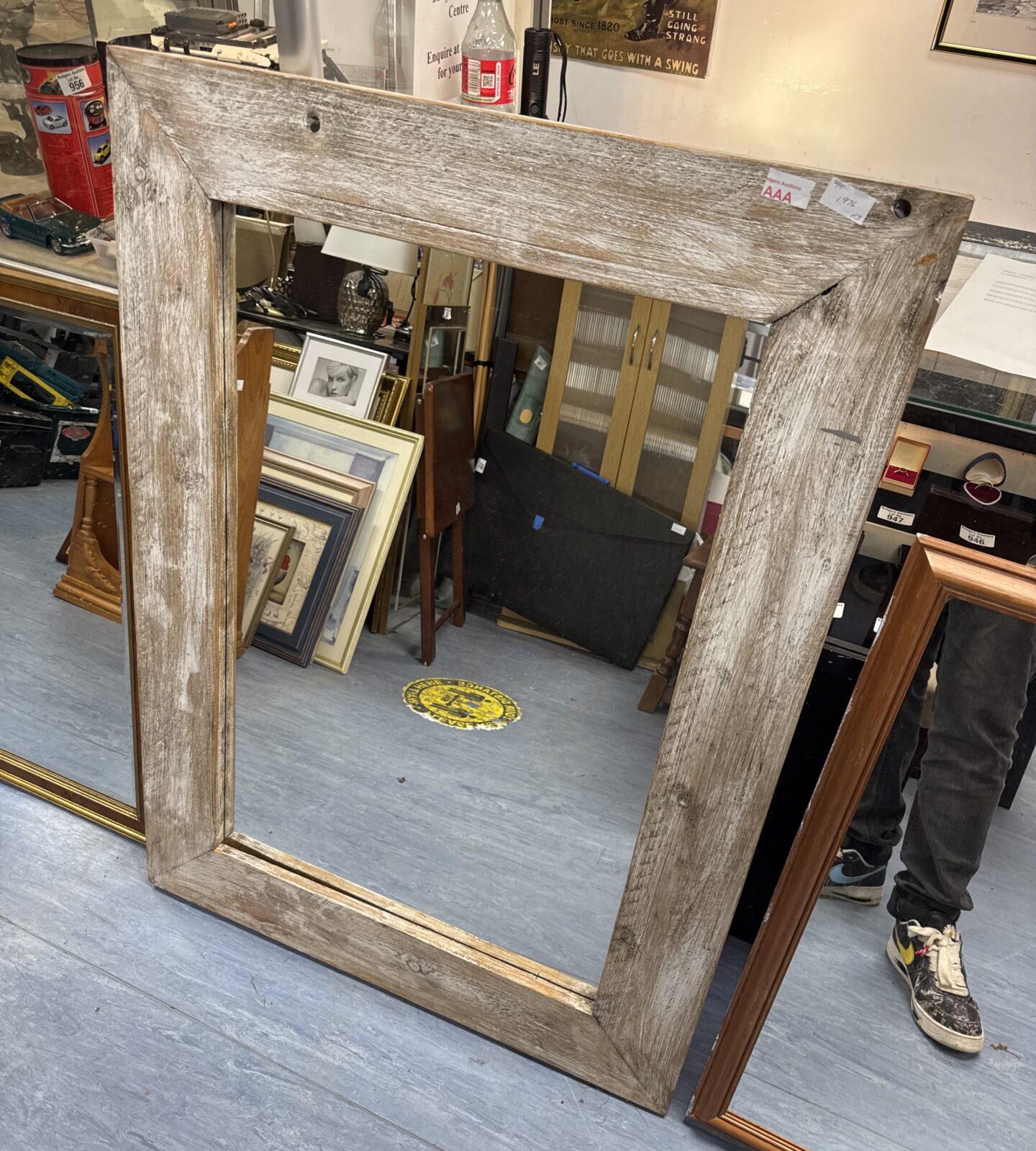 Shabby chic style antique mirror with distressed frame.