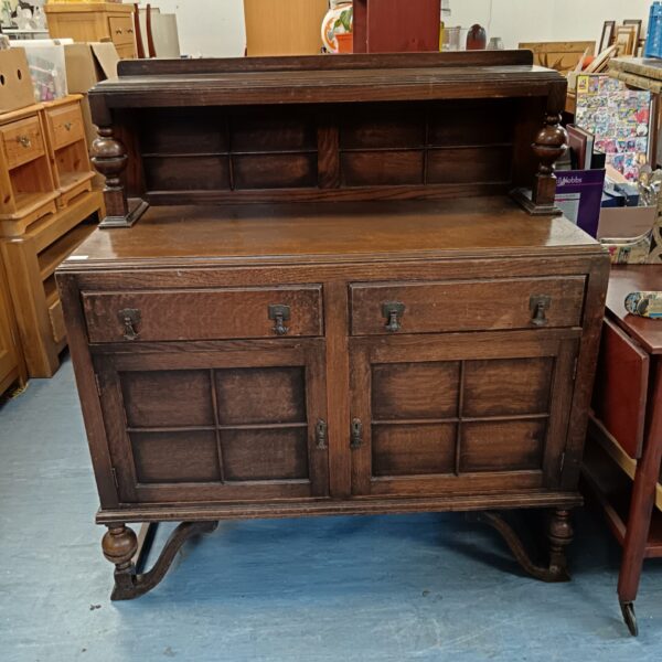 Antique oak chiffonier sideboard with carved details.