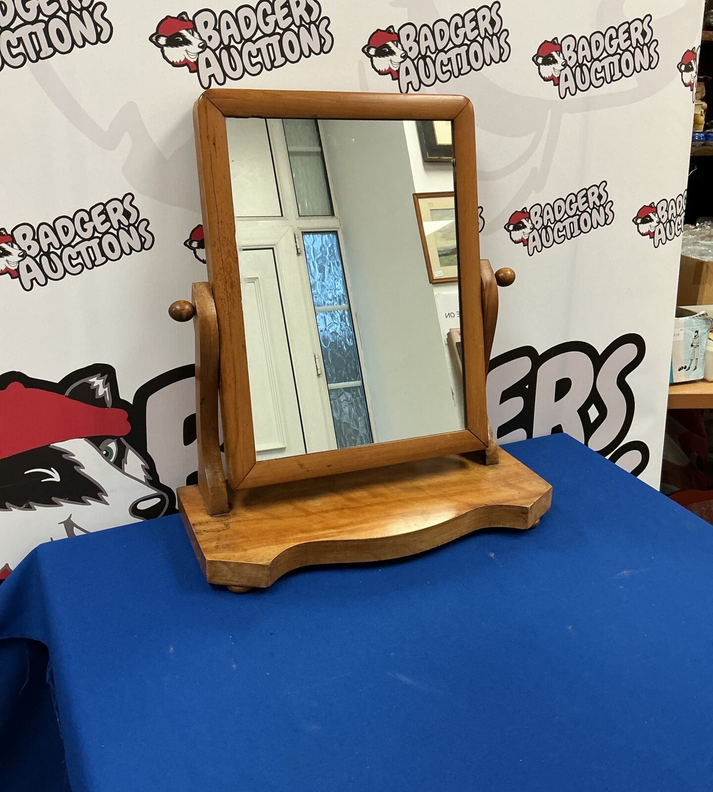 Antique oak dressing table mirror with a clear reflection.