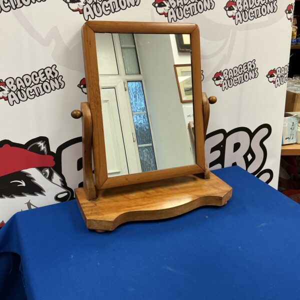 Antique oak dressing table mirror with a clear reflection.