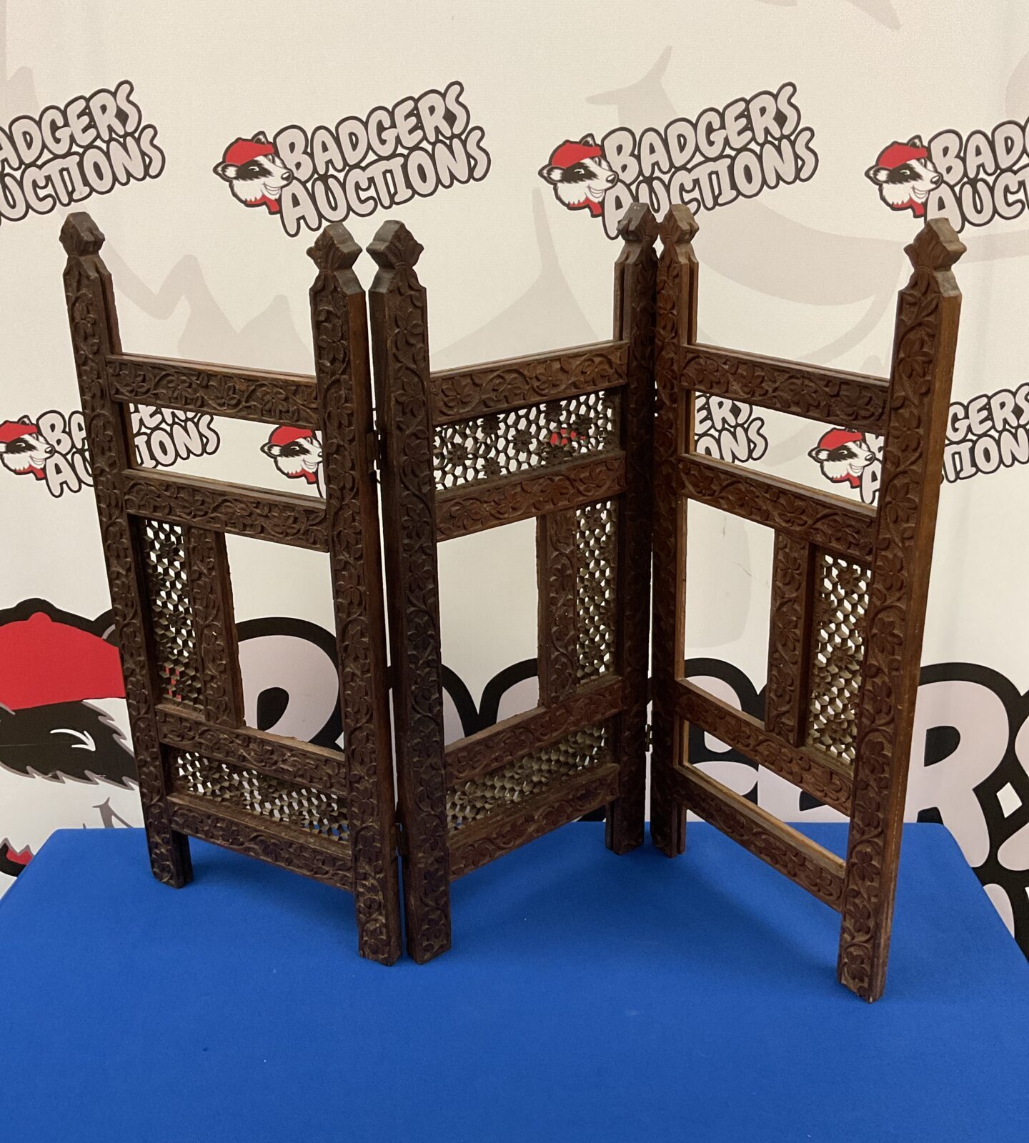 Antique oak privacy screen with detailed vine carvings.