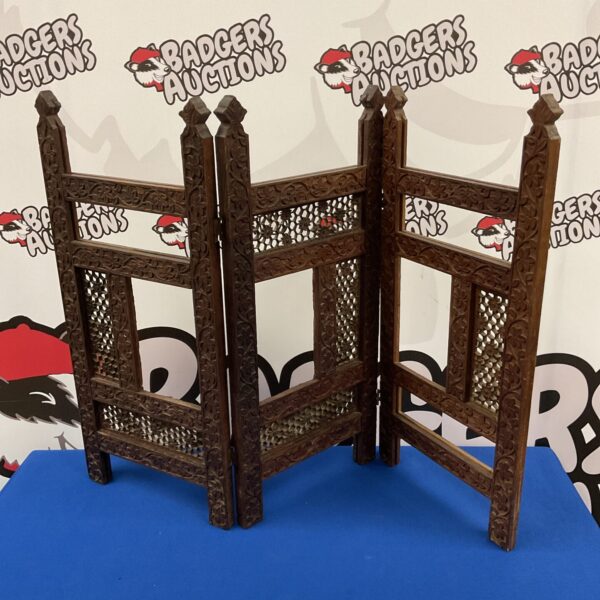 Antique oak privacy screen with detailed vine carvings.