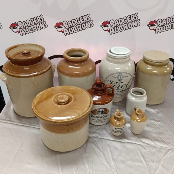 Antique salt-glazed stoneware jars and pots in a collection.