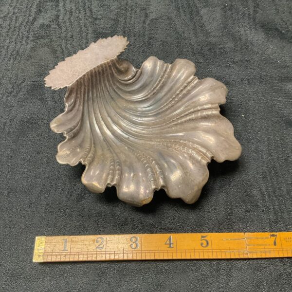 Antique silver leaf dish with intricate detailing.