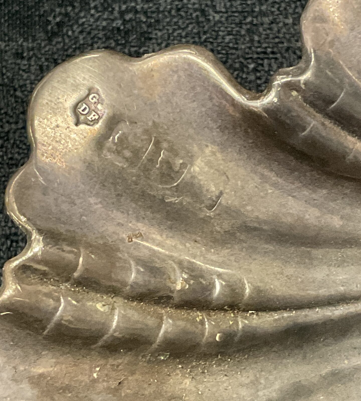 Antique silver leaf dish with ruler for scale.