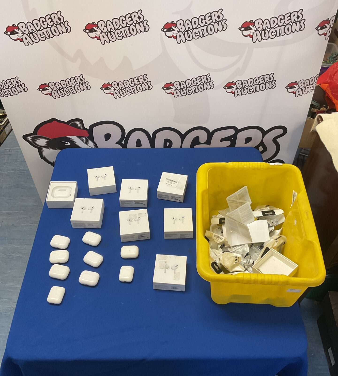 Apple Airpods Pro lot with boxes and charging plugs.