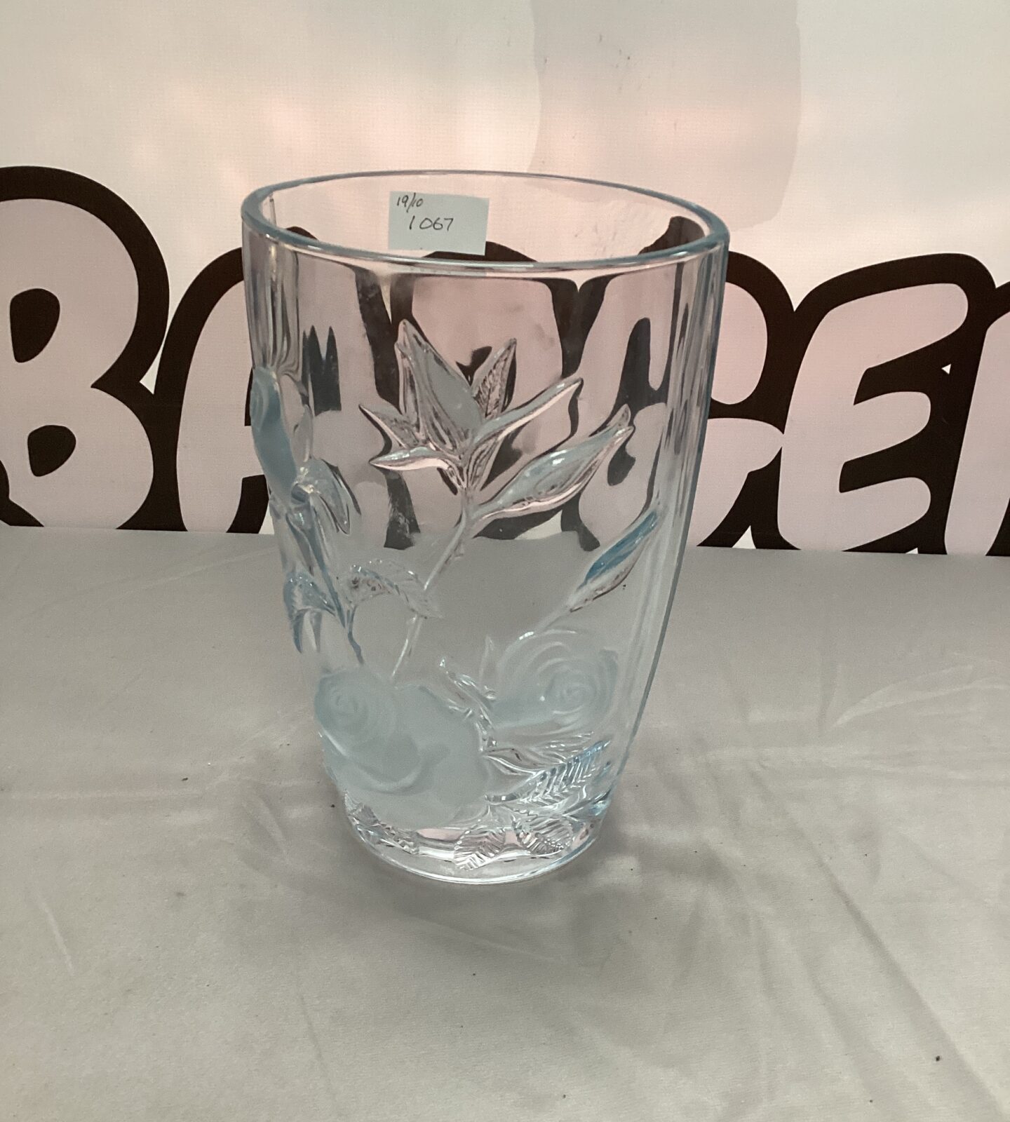 Elegant Arc crystal vase with a sculpted rose design.