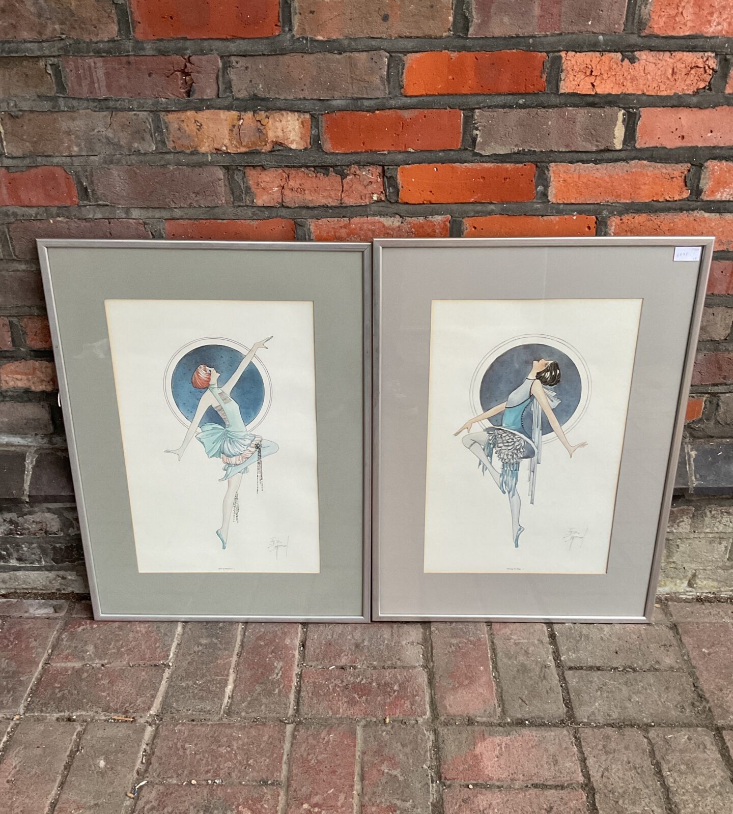 Pair of vintage Art Deco flapper prints in ornate frames.
