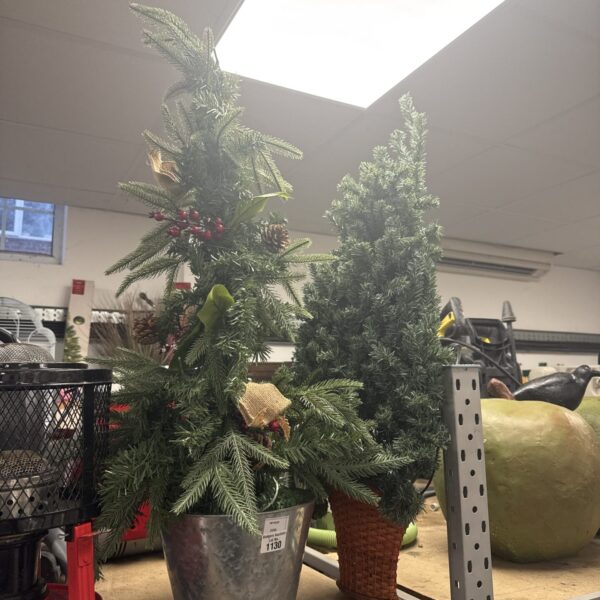 Small artificial Christmas tree, ideal for wall hanging or tabletop display.