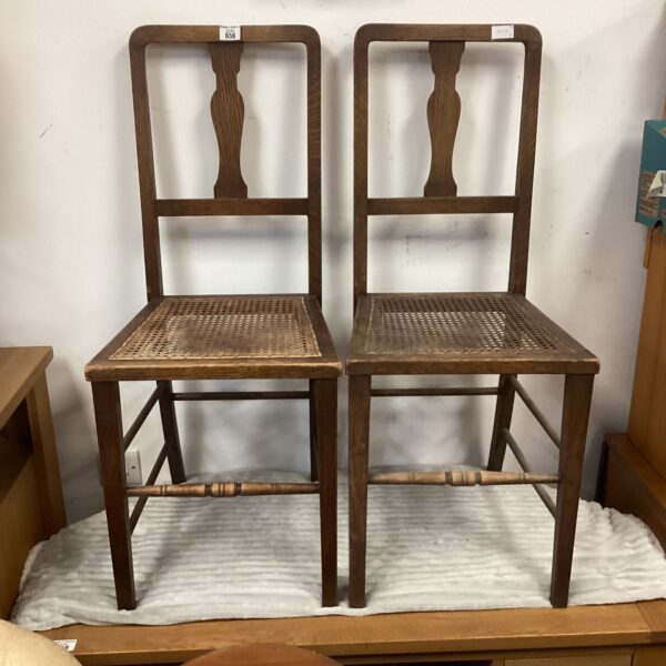 Pair of antique Arts and Crafts chairs with cane seats.