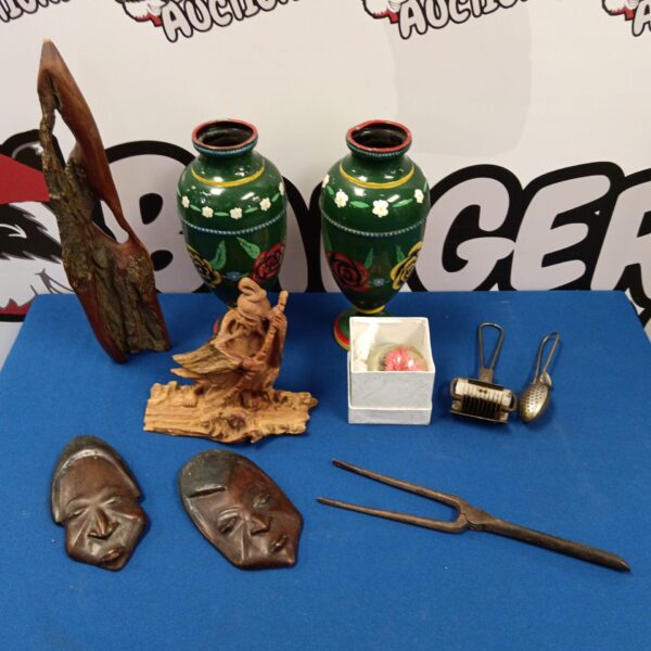 Overview of diverse Asian collectibles lot including vases and masks.