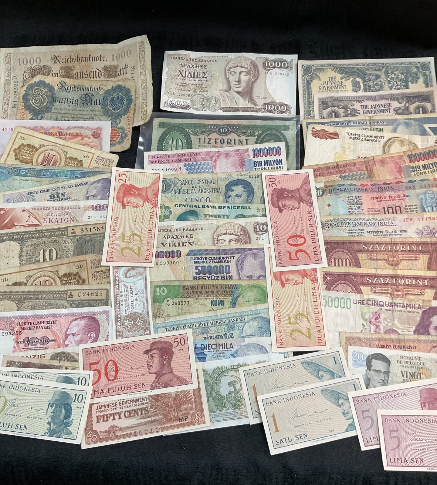 Diverse collection of assorted bank notes and world currency.
