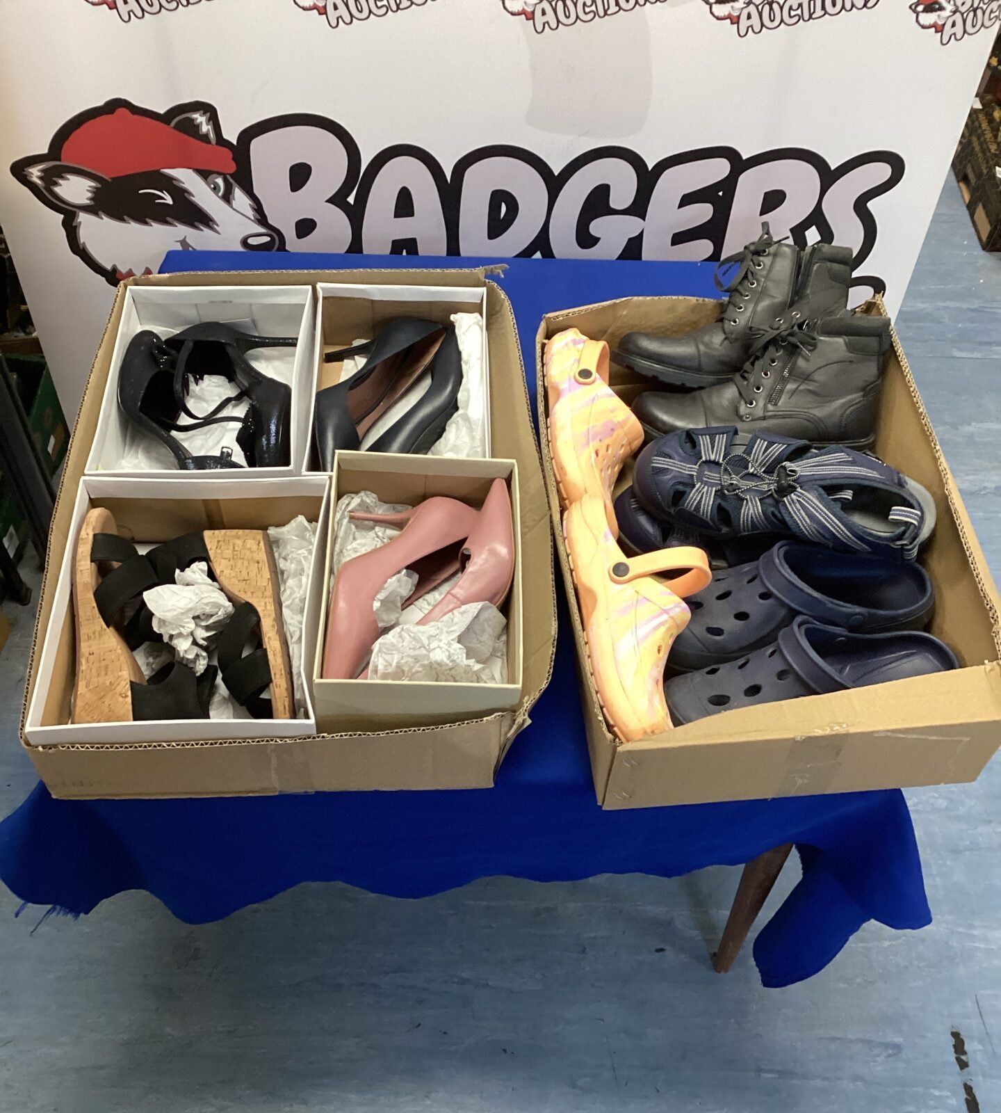 Assorted footwear lot in two boxes, mixed styles and sizes.