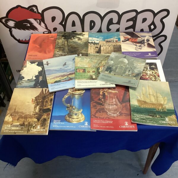 Lot of auction price guides for art and silverware collectibles.