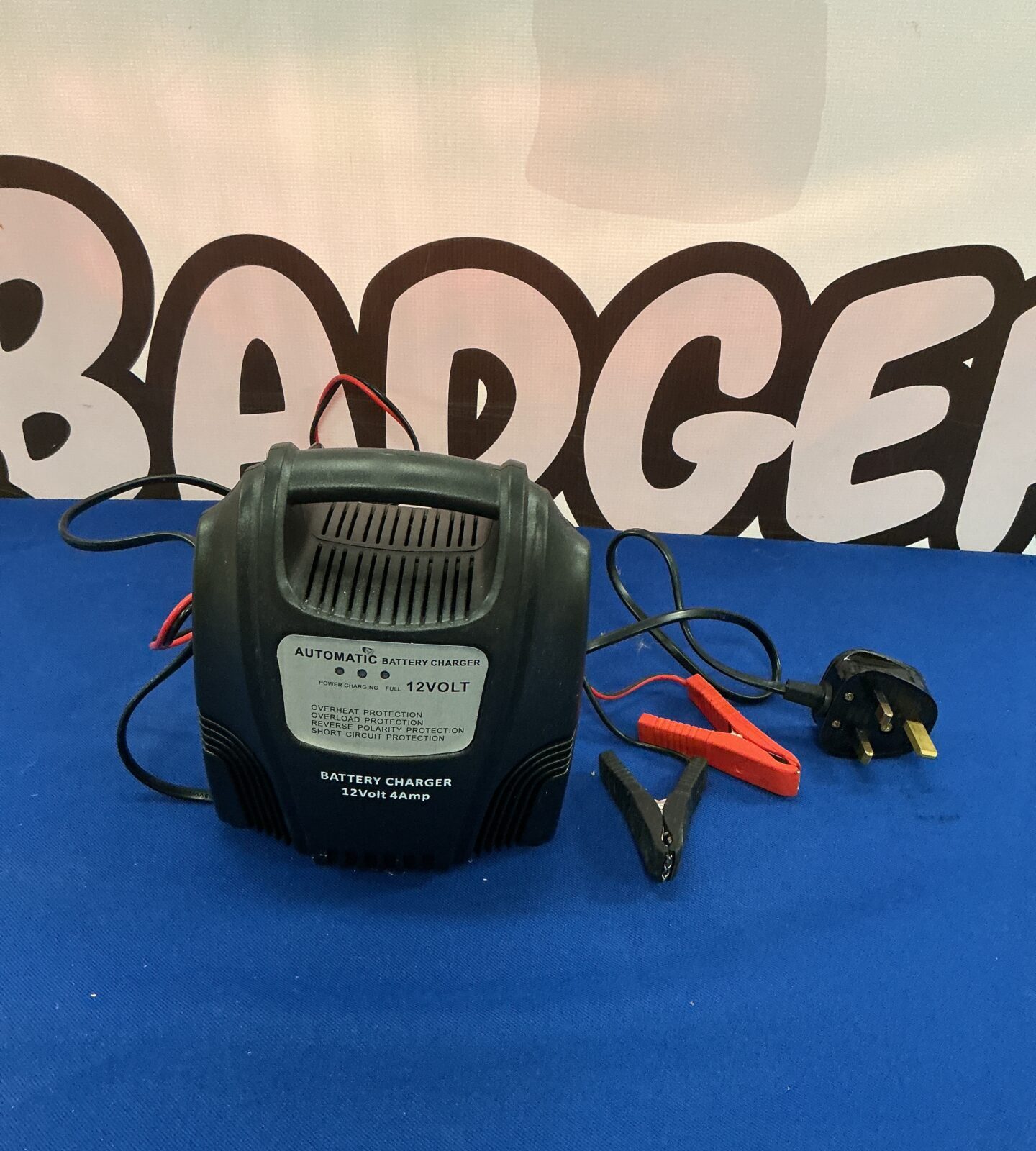 Used 12V automatic battery charger for vehicle maintenance.
