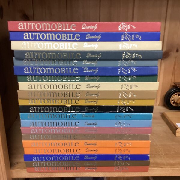 Bundle of vintage Automobile Quarterly books for car enthusiasts.