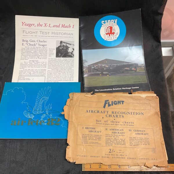 Vintage aviation ephemera collection featuring WWII Lancaster bomber magazine and charts.