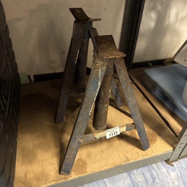 Pair of metal axle stands for vehicle maintenance and repair.