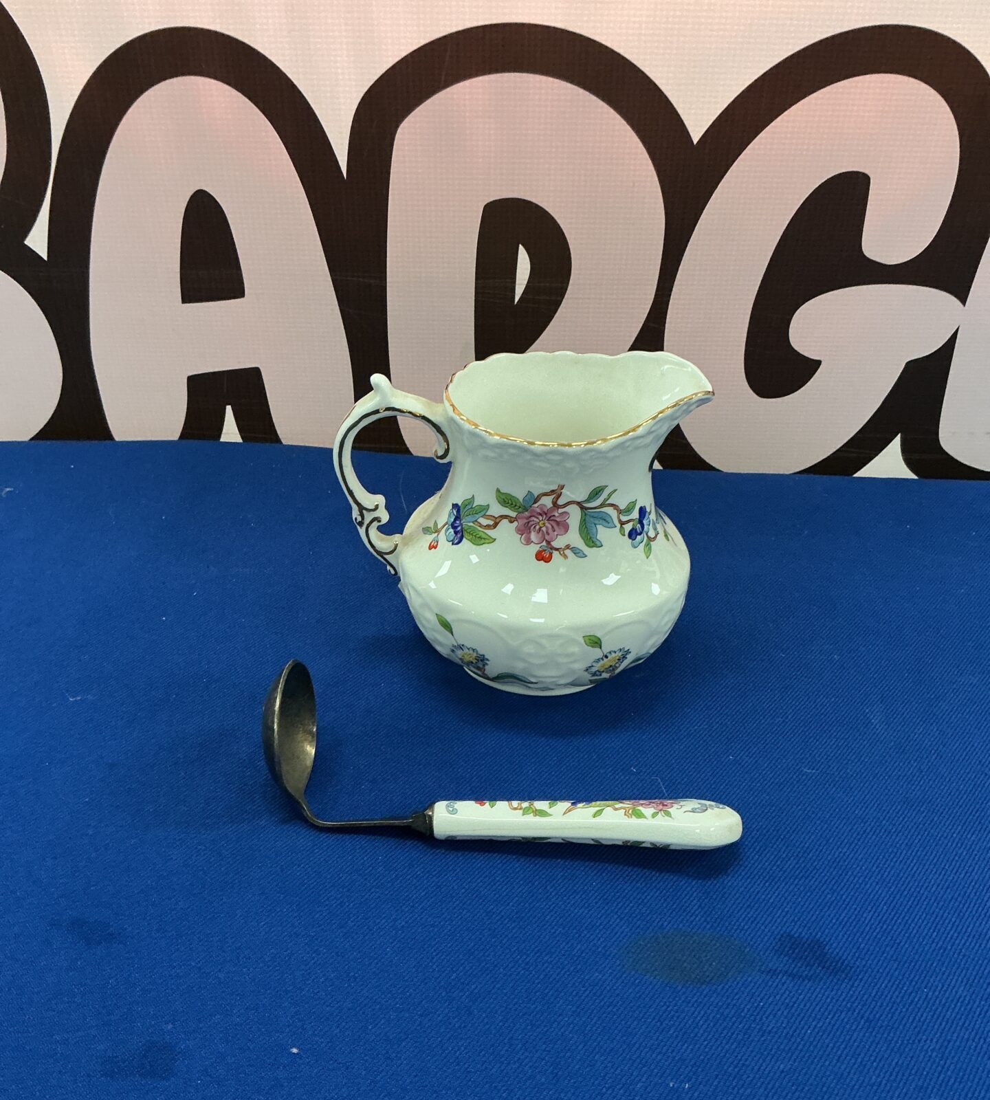 Vintage Aynsley bone china gravy boat with floral design and spoon.