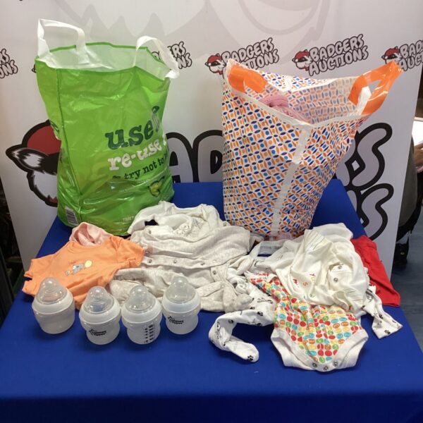 Mixed baby clothes and Tommee Tippee bottles in a bundle.
