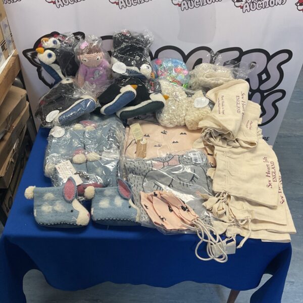 Baby gift bundle with soft toys and felt decorations.