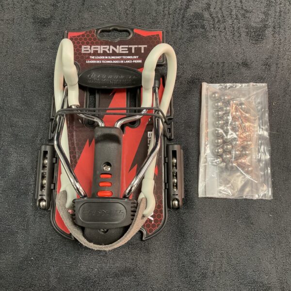 Black Barnett Black Widow slingshot with spare shot for outdoor recreation.